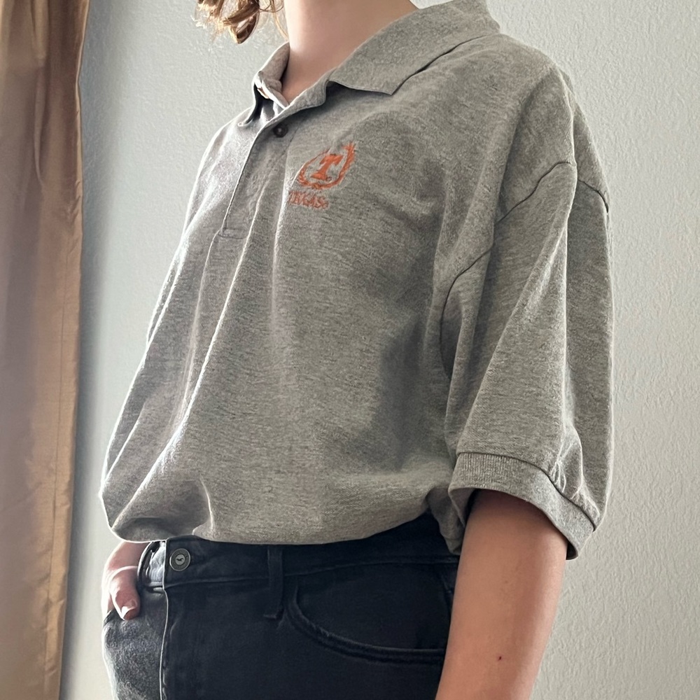University of Texas polo top. Grey with university emblem. Size large.